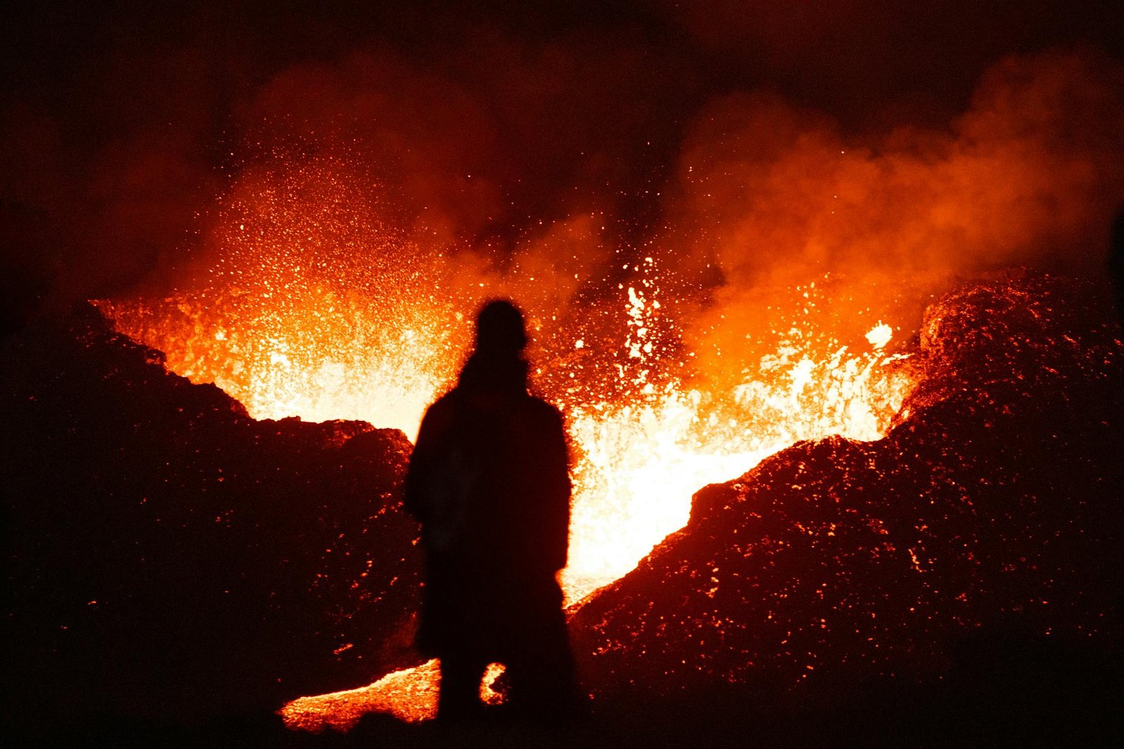 Person Standing near Burning Lava